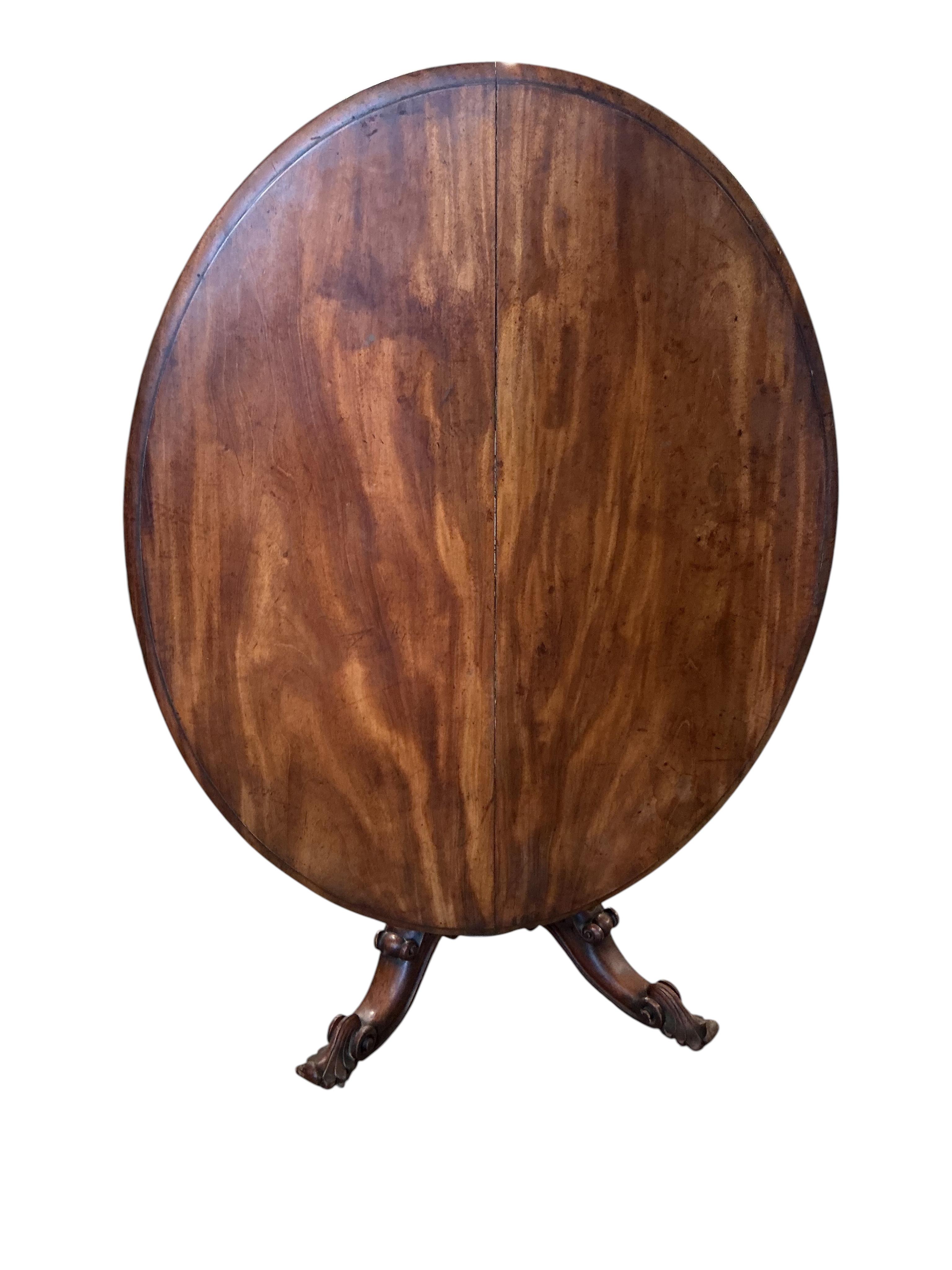 An early Victorian oval mahogany tilt top loo table, width 108cm, depth 140cm, height 71cm